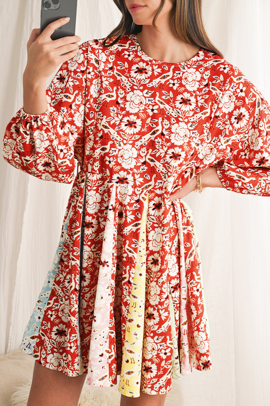 Woman wearing a red floral dress with a white background