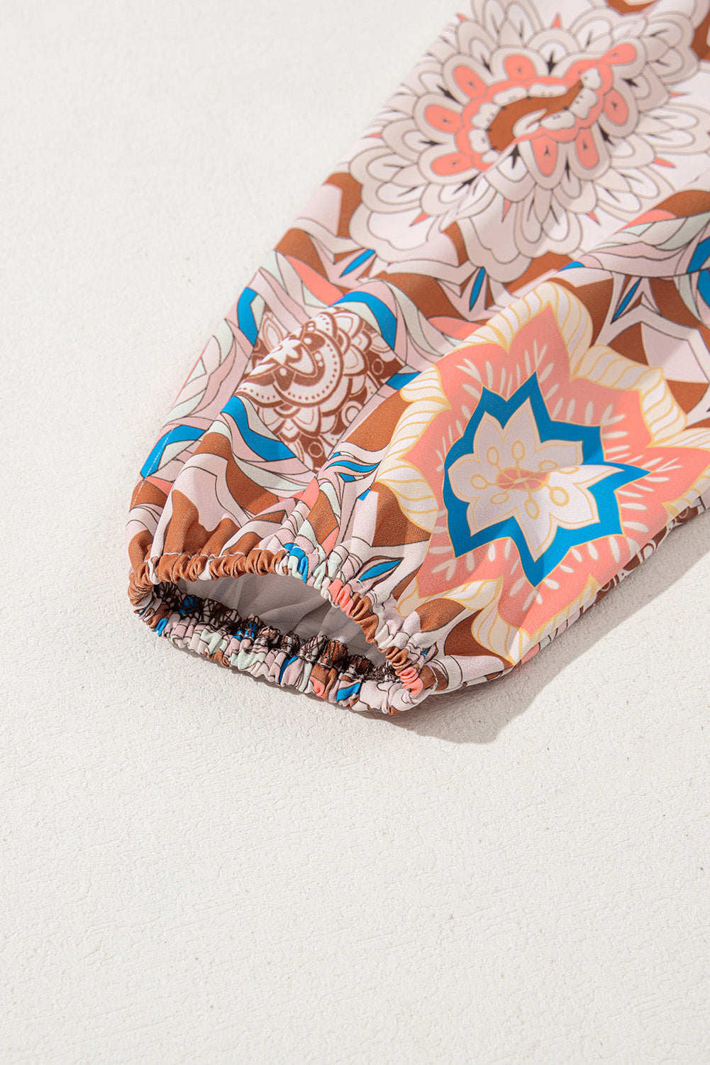 Floral-patterned swim cap on a white background