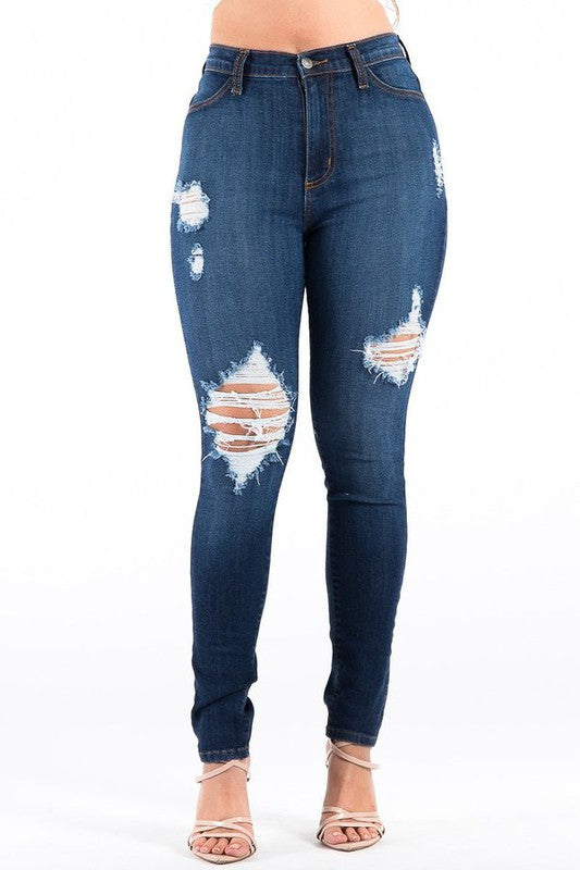 Distressed blue jeans on a white background