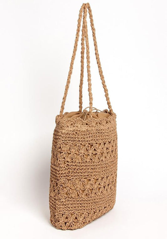 Woven jute bag with a strap on a white background