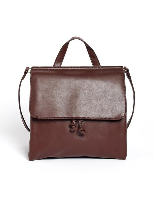 Brown leather handbag with a strap on a white background