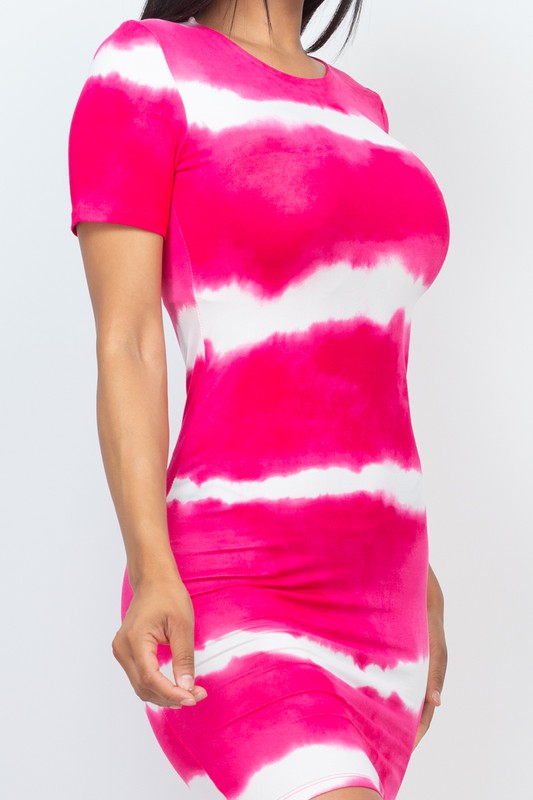 Pink and white tie-dye dress on a plain background