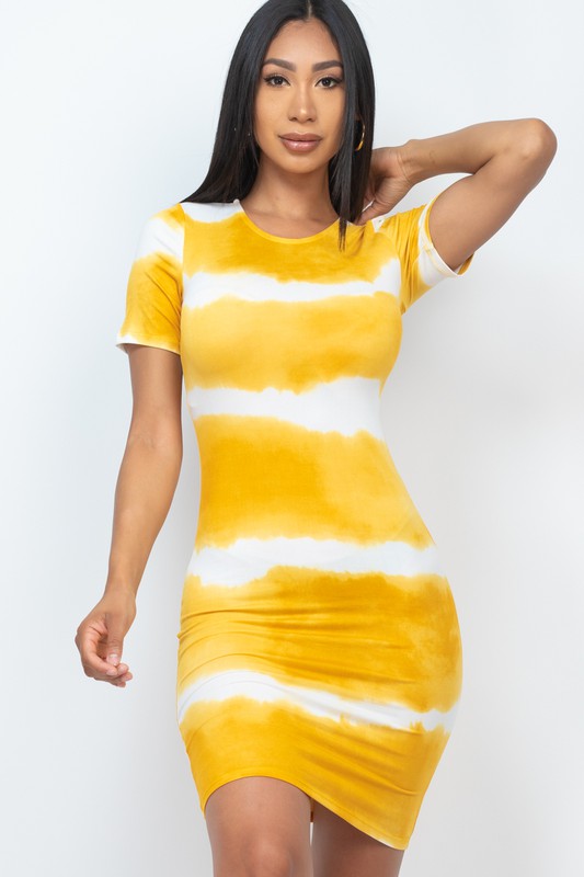 Woman wearing a yellow and white striped dress on a white background