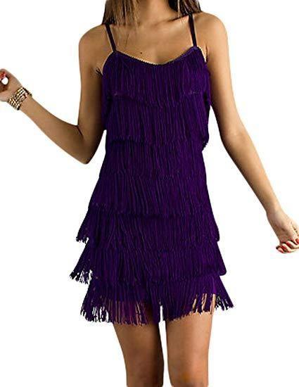 Purple fringe dress worn by a person on a white background