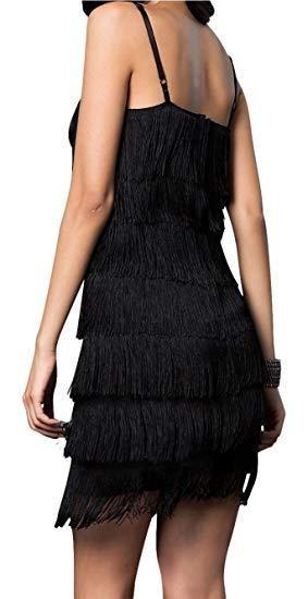 Black fringe dress worn by a model on a white background