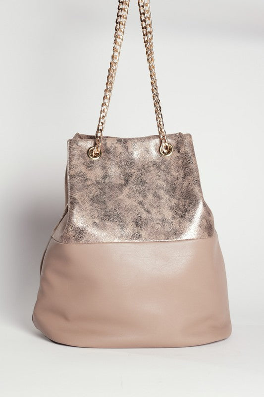 Bucket bag with metallic top section and beige bottom on a white background