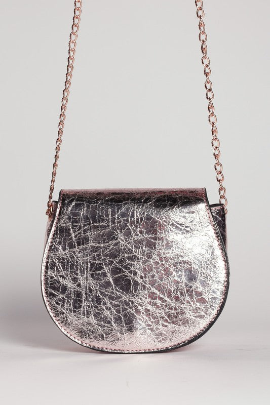 Silver textured handbag with a chain strap on a light gray background