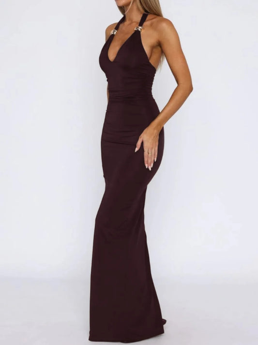 Brown halter neck gown on a white background