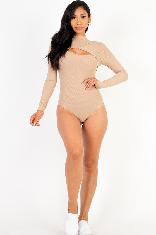 Woman wearing a beige bodysuit on a white background