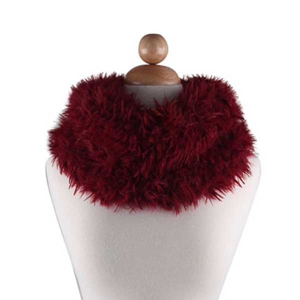 Maroon fur scarf on a mannequin with a white background