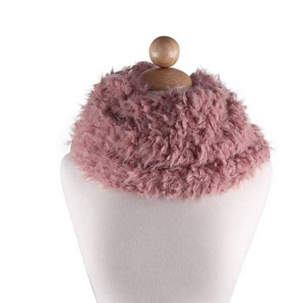 Pink fuzzy scarf on a white mannequin with a wooden knob on a white background