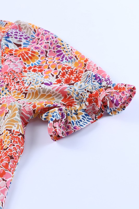 Colorful floral-patterned headscarf on a white background