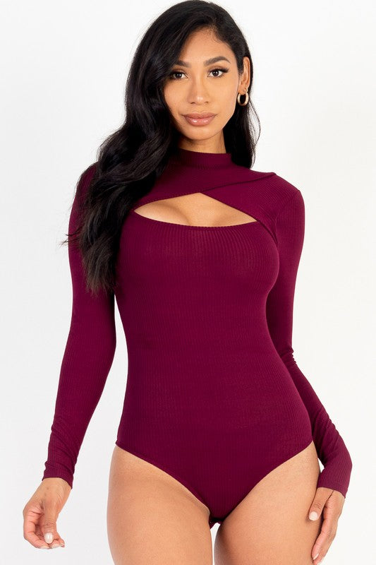 Woman wearing a burgundy long-sleeve bodysuit with cut-out design on a white background