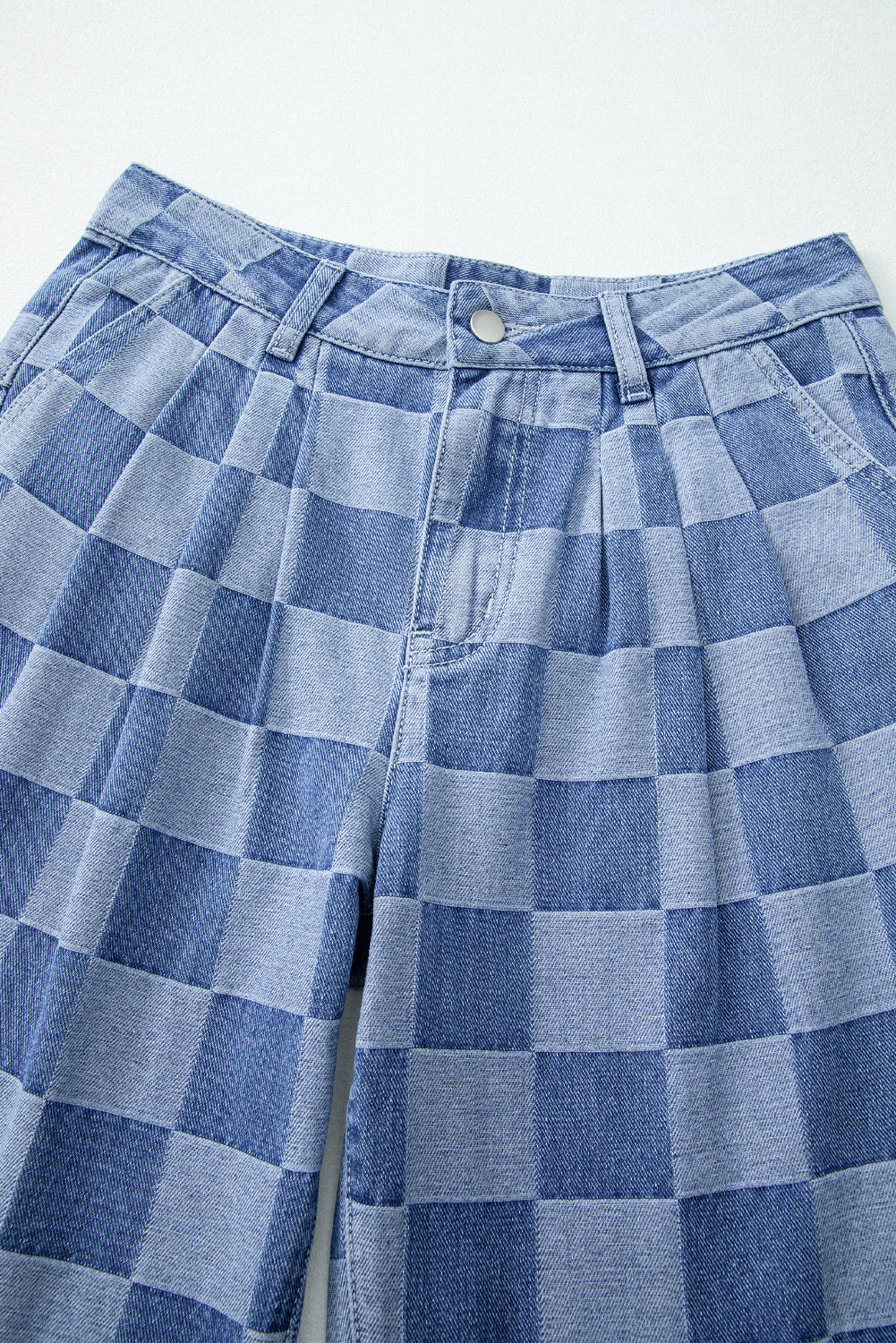 Blue checkered pants on a white background