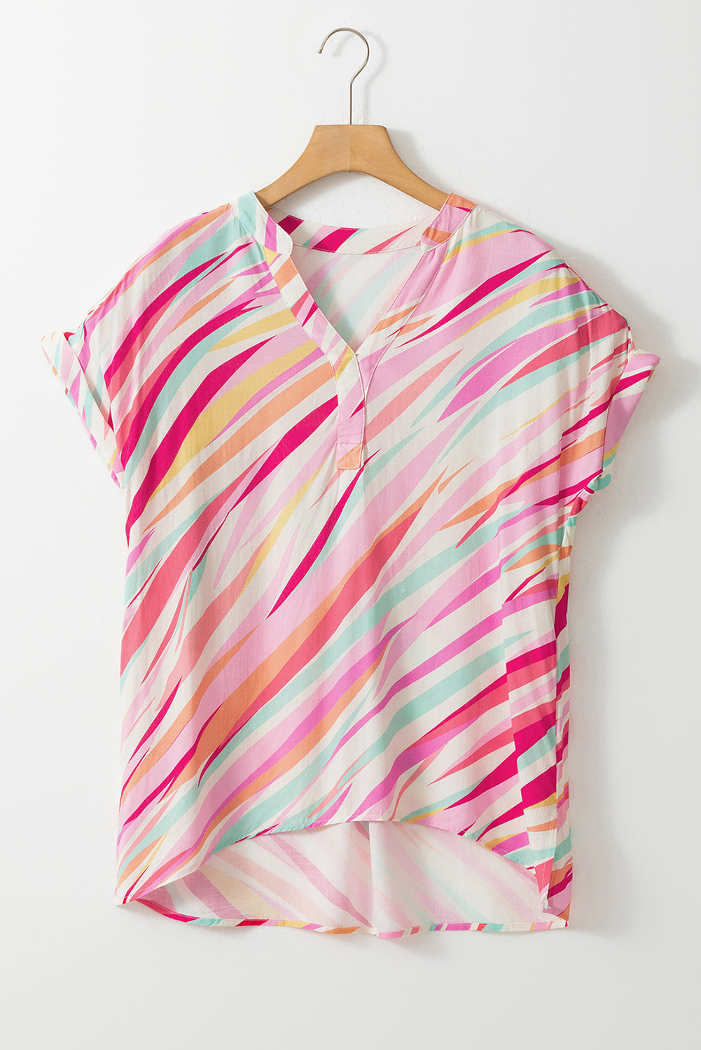 Colorful striped shirt on a hanger against a white background