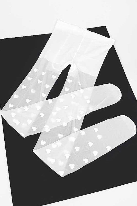 White paper with heart patterns on a black background
