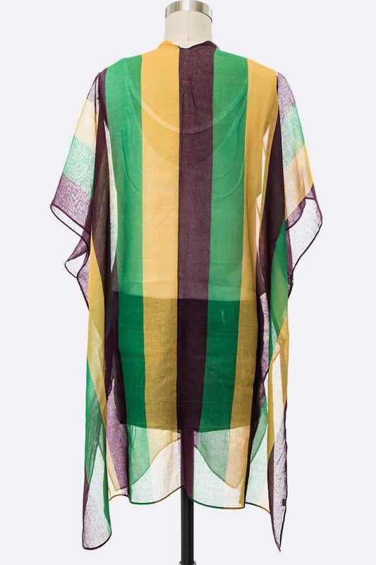 Colorful striped scarf on a mannequin against a white background