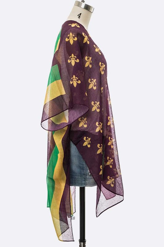 Colorful scarf with geometric patterns on a mannequin against a white background