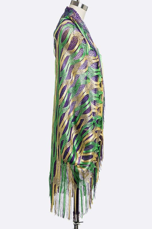 Colorful fringe dress on a mannequin against a white background