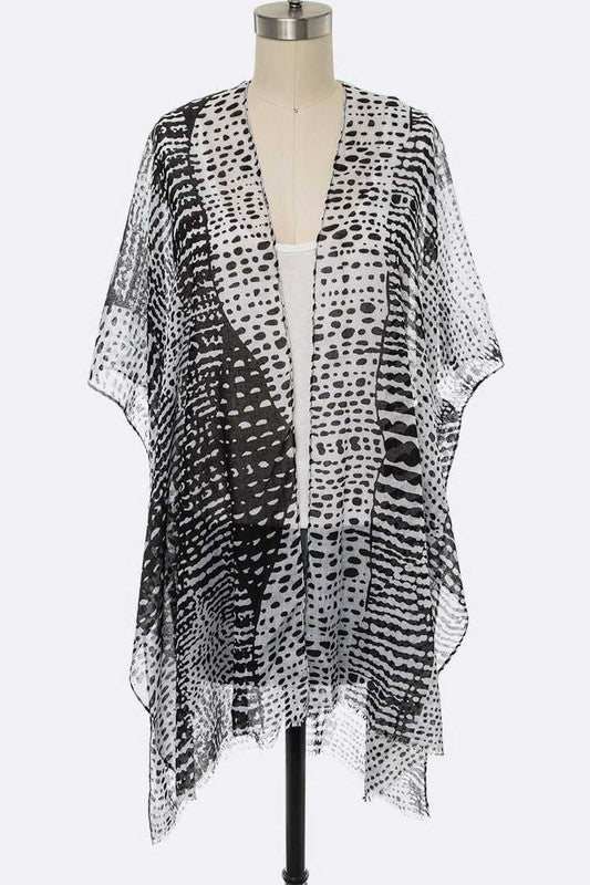 Black and white patterned kimono-style garment on a mannequin against a white background