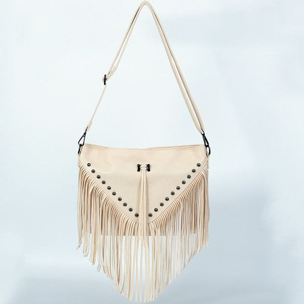 Beige fringe handbag with stud details on a light gray background