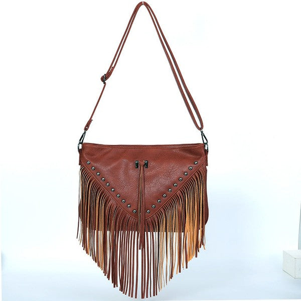 Brown leather handbag with fringe details on a white background