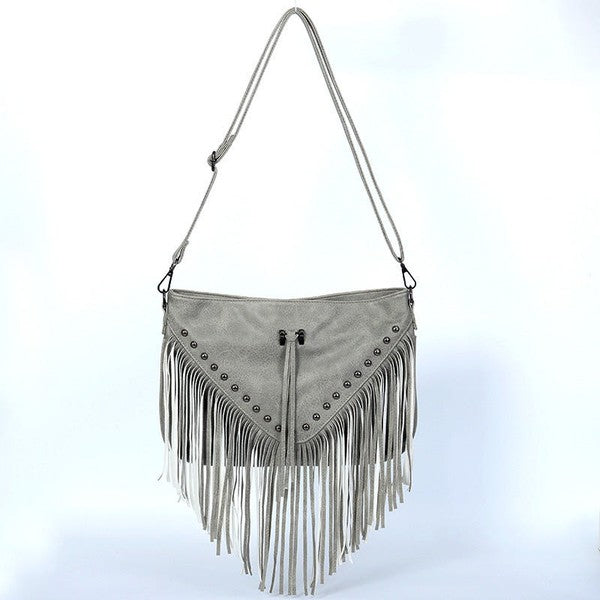 Gray fringe handbag with decorative elements on a light blue background