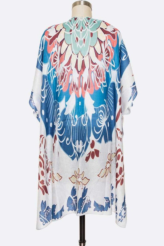 Colorful floral kimono on a mannequin against a white background