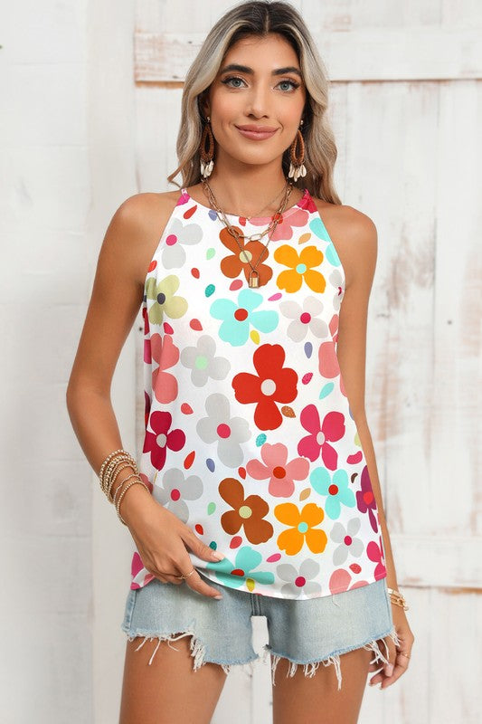 Woman wearing a colorful floral tank top against a wooden background