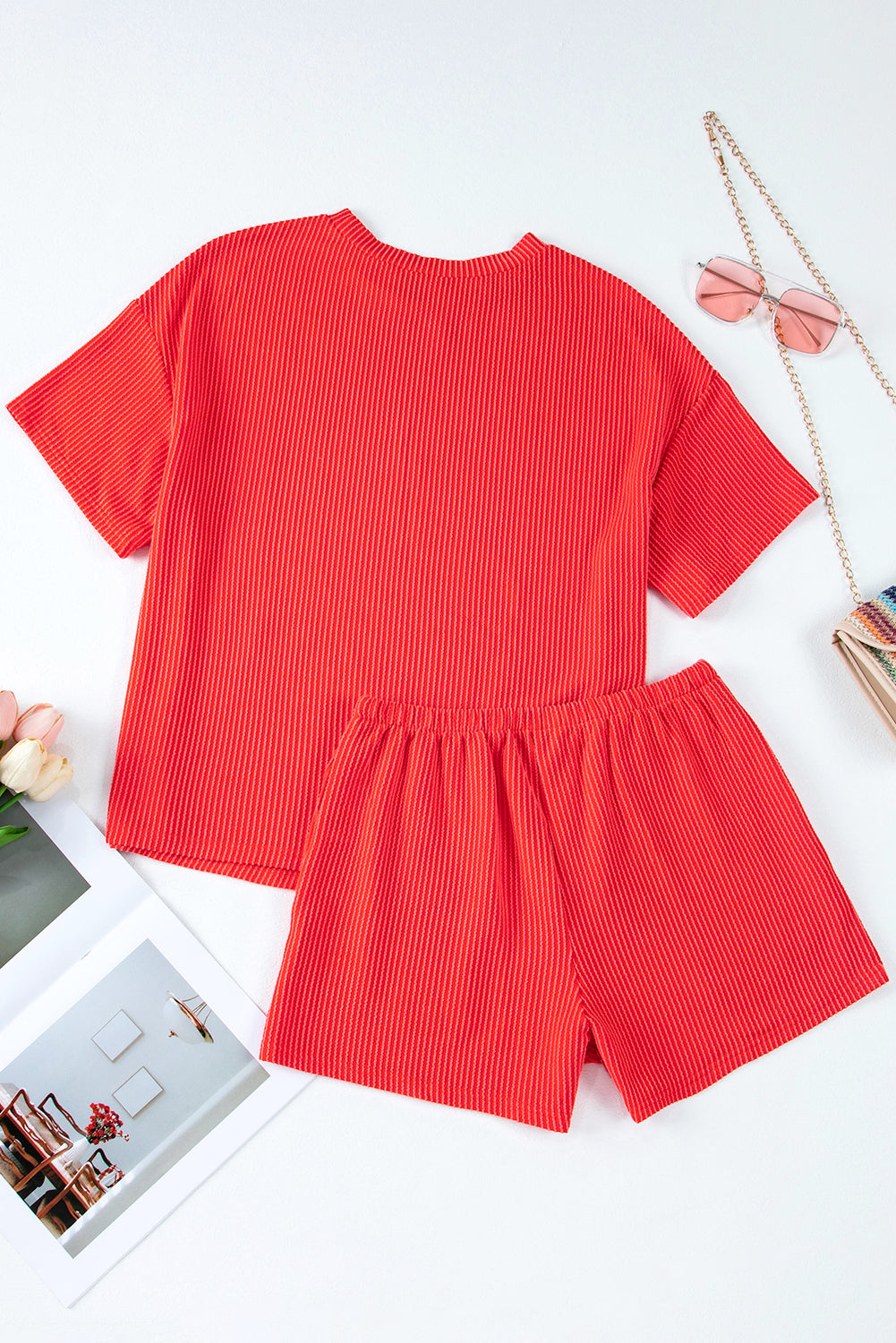 Red ribbed top and shorts set on a white background