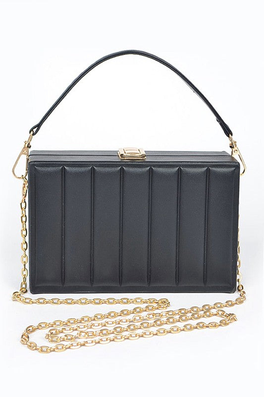 Black clutch bag with gold chain on a white background