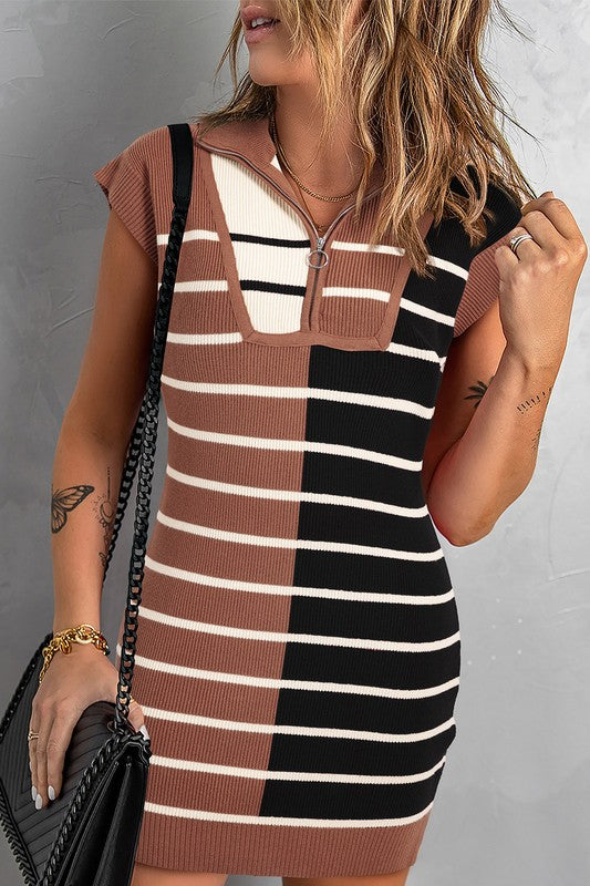 Woman wearing a striped dress with brown, black, and white pattern against a gray background