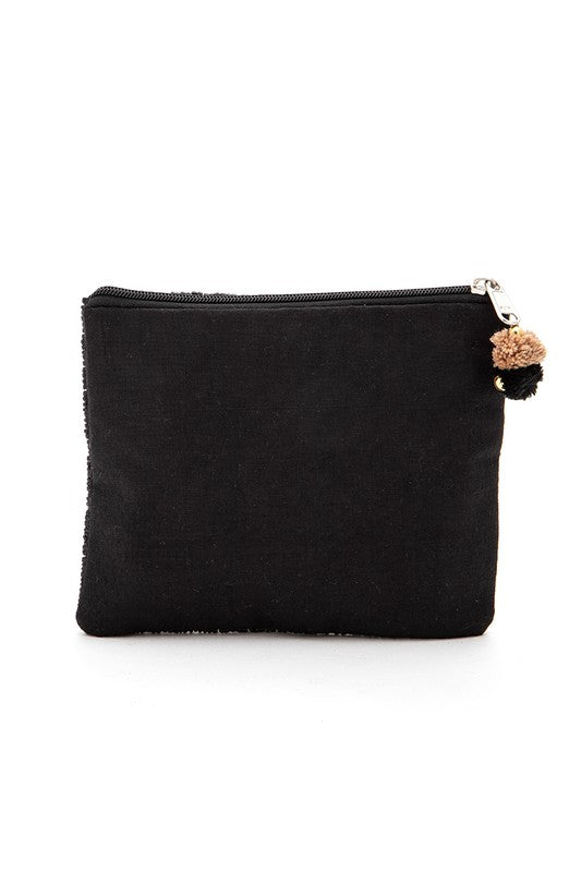 Black pouch with a decorative pom-pom on a white background