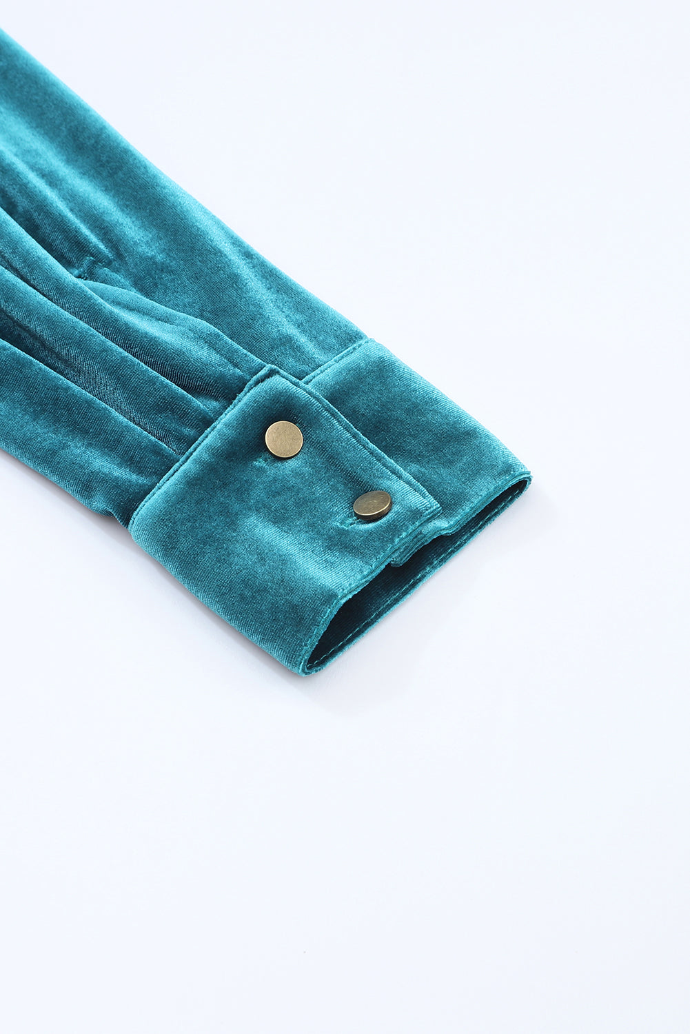 Teal velvet fabric with buttons on a white background