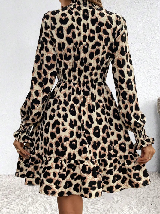 Leopard print dress worn by a person on a white background