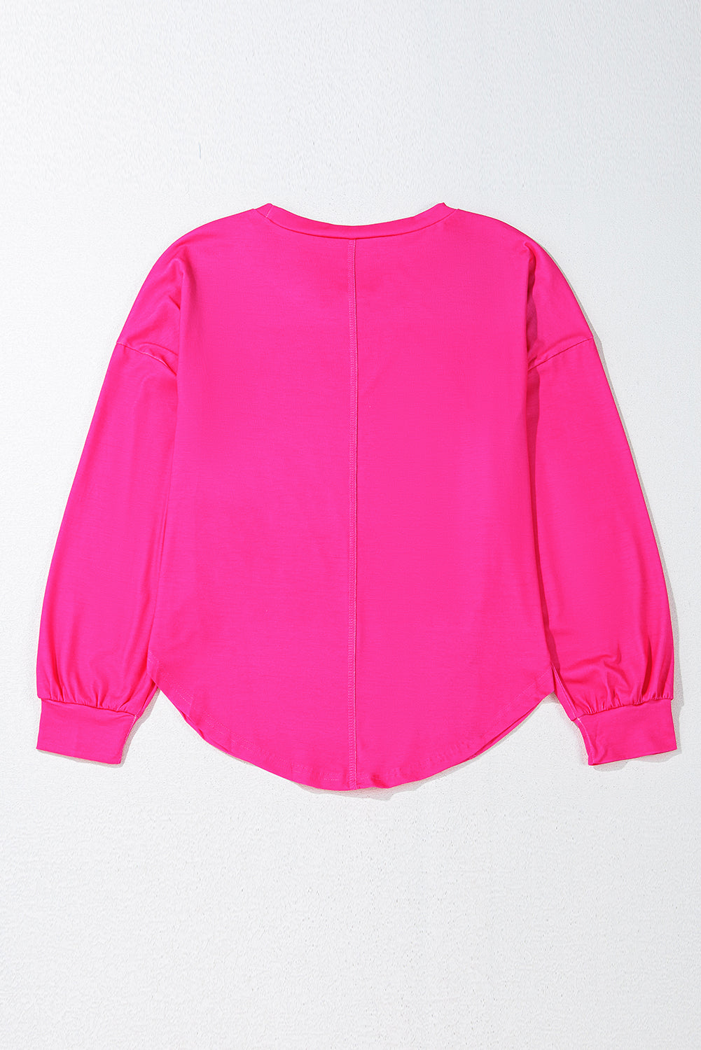 Pink blouse with long sleeves on a white background