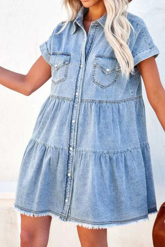 Denim dress worn by a person with a blurred background
