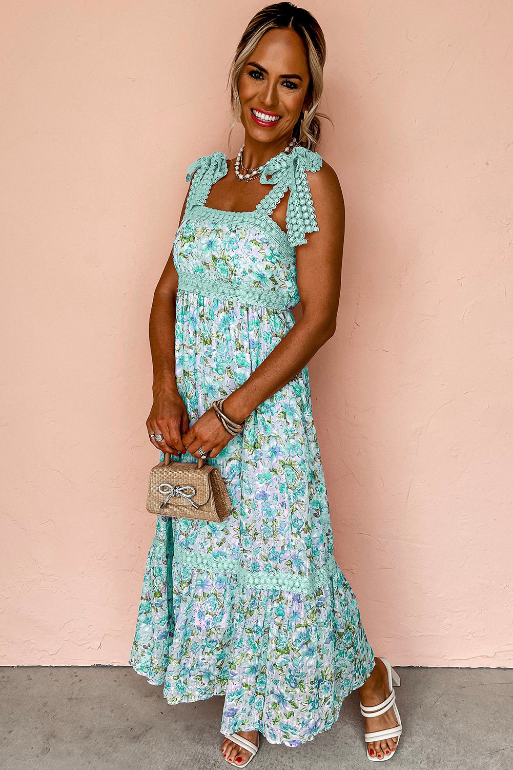 Woman wearing a floral dress against a beige background
