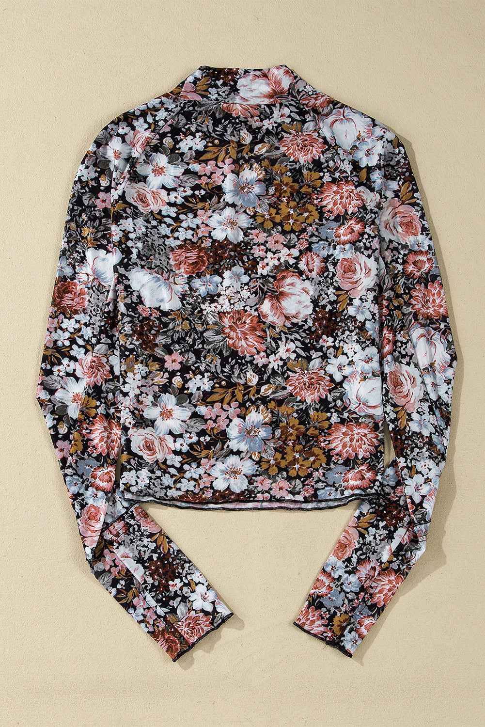 Floral patterned shirt on a beige background