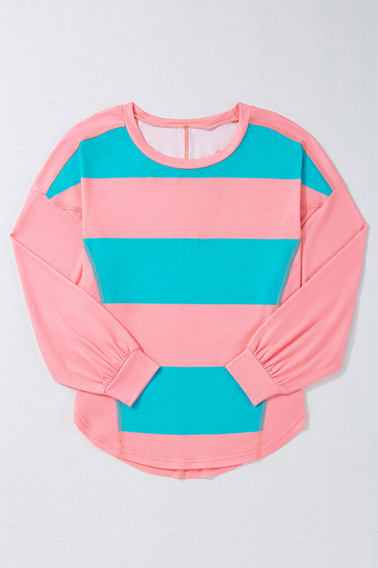 Pink and blue striped long-sleeve shirt on a light gray background