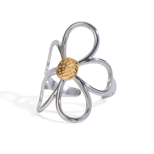 Silver ring with a gold center on a white background