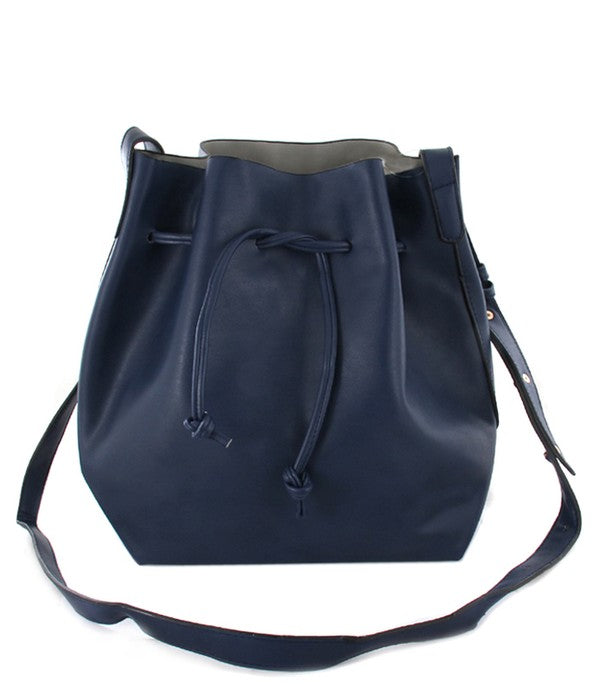 Navy blue leather bucket bag with drawstring on a white background