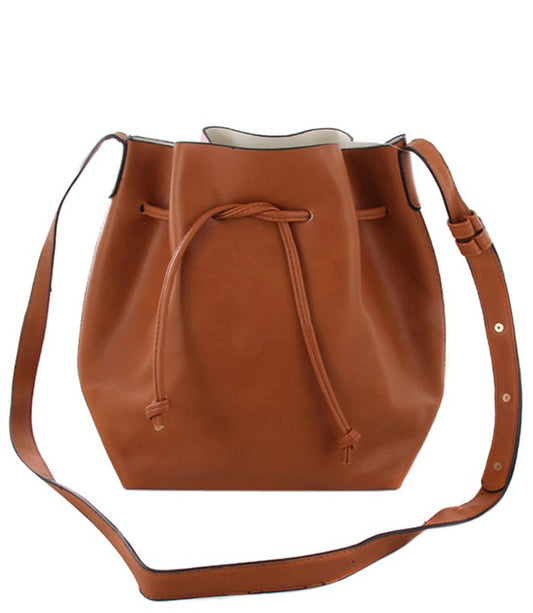 Brown leather bucket bag with drawstring on a white background