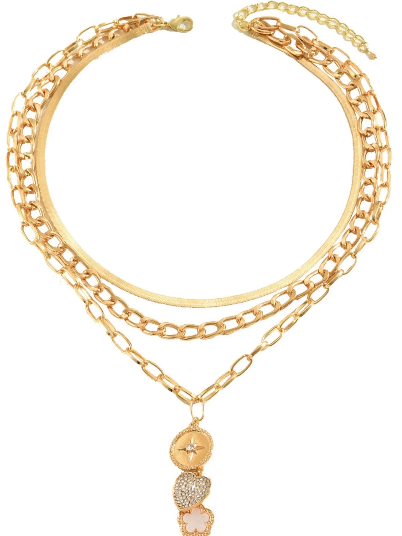 Gold chain bracelet with heart-shaped charms on a white background