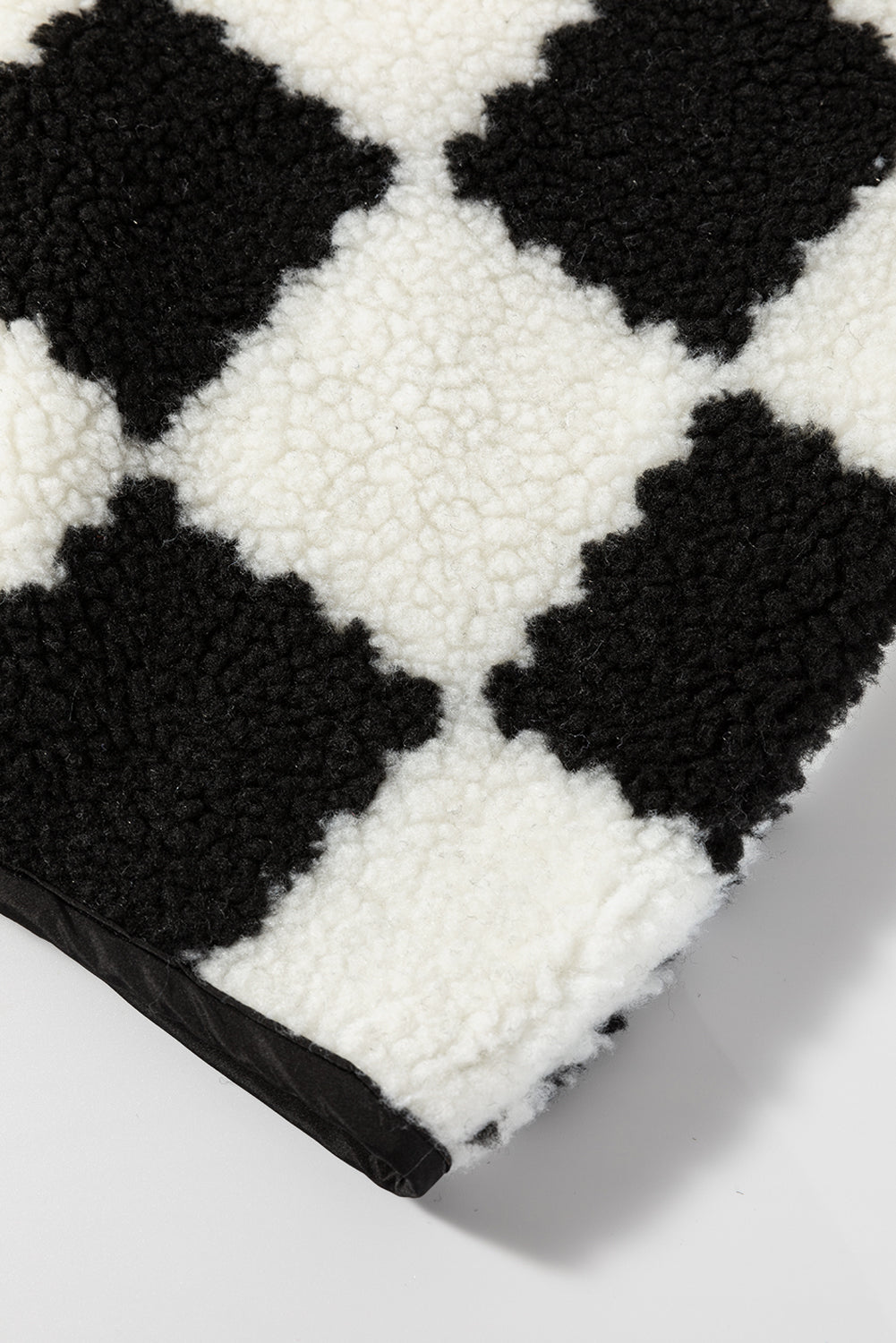 Close-up of a black and white checkered pattern fabric
