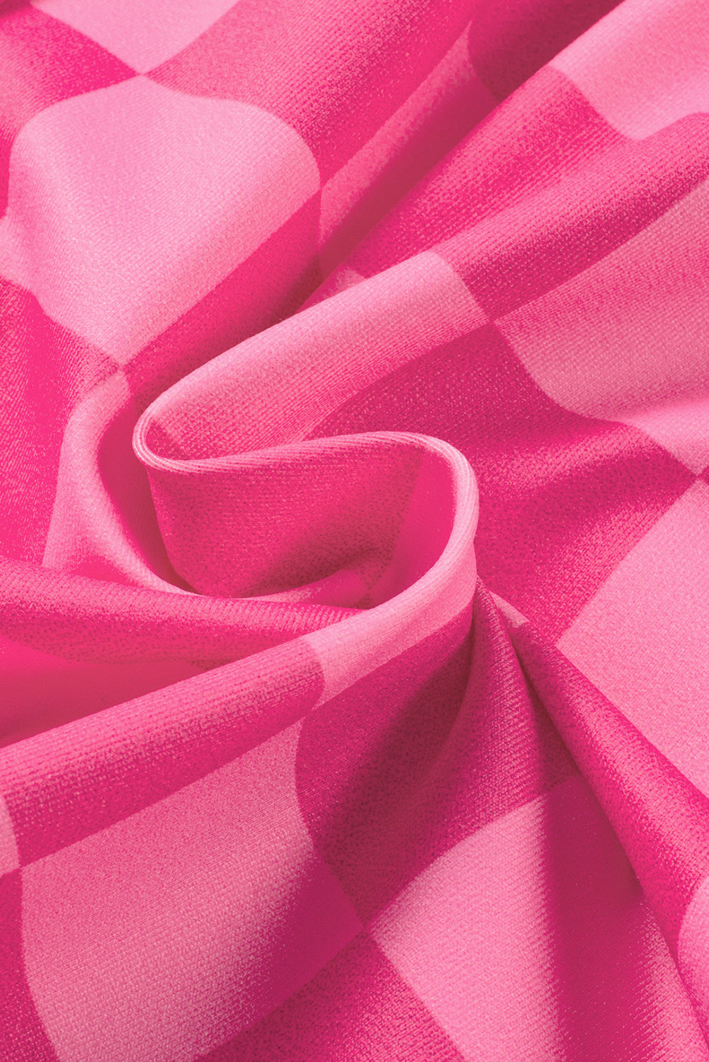 Close-up of pink fabric with a checkered pattern