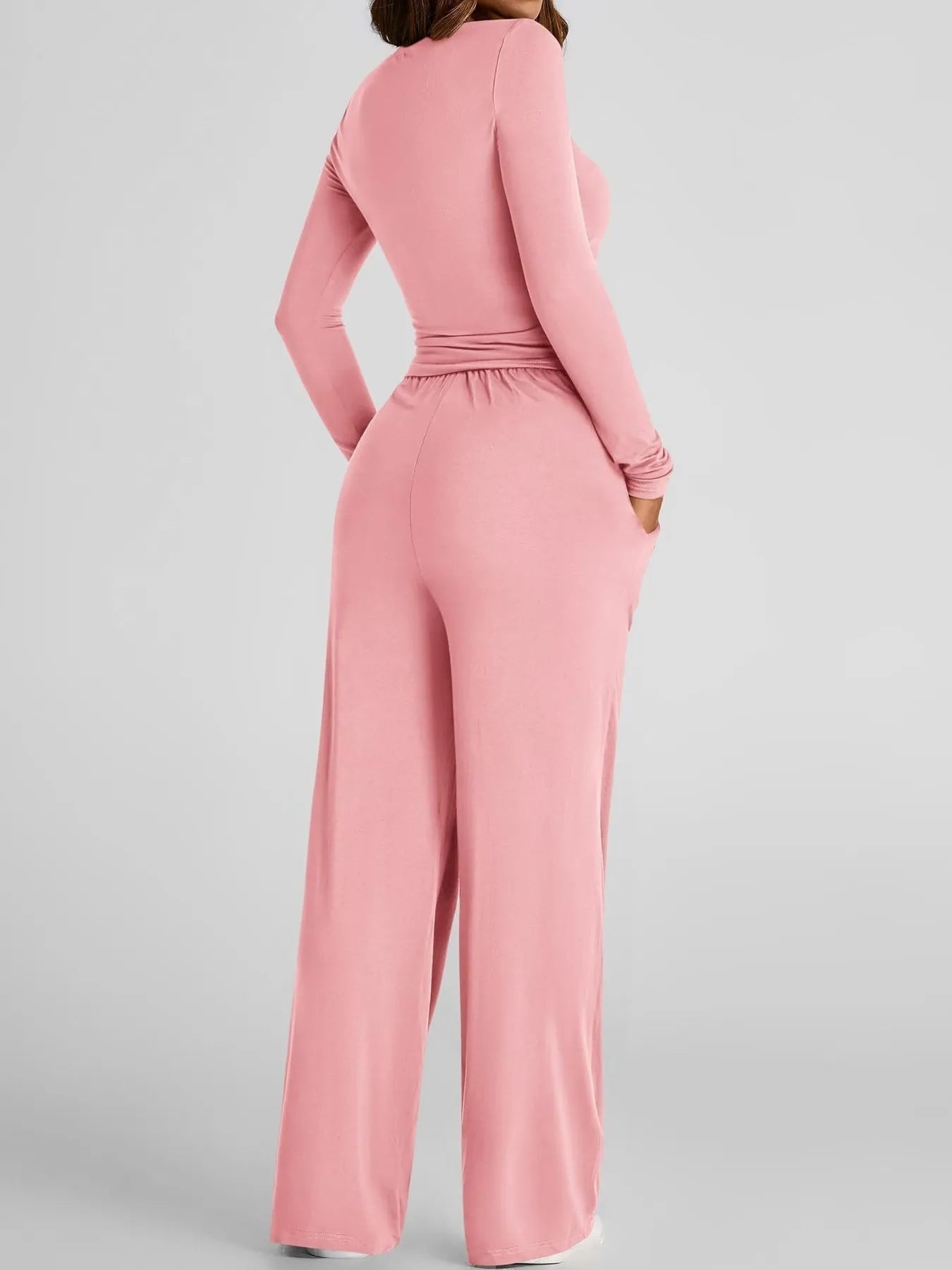 Pink jumpsuit on a plain background