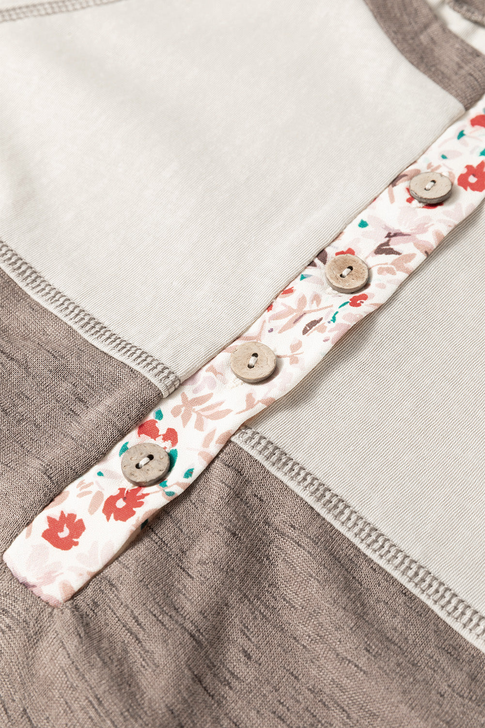 Floral strap with buttons on a garment