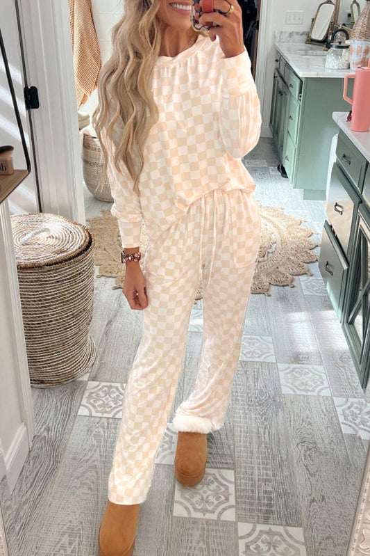Person wearing a white textured loungewear set in a home setting.