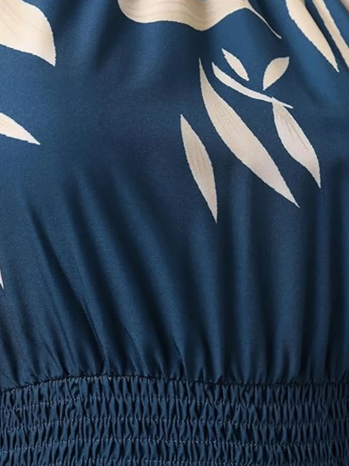 Navy blue fabric with beige leaf pattern